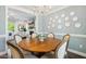 Cozy dining room with elegant chandelier and wood table for Gathering gatherings at 5172 Copain Cove, Fuquay Varina, NC 27526