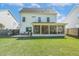 Back exterior view of the home and fenced yard at 5172 Copain Cove, Fuquay Varina, NC 27526