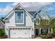 Charming two-story home featuring a two-car garage and landscaped front yard at 5172 Copain Cove, Fuquay Varina, NC 27526