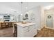 Kitchen island with seating and storage offers an open view of the spacious living room at 5172 Copain Cove, Fuquay Varina, NC 27526