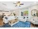 Spacious living room with comfortable seating and a large window overlooking the yard at 5172 Copain Cove, Fuquay Varina, NC 27526