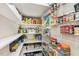Well-organized pantry with adjustable shelving and ample storage space for groceries and household items at 5172 Copain Cove, Fuquay Varina, NC 27526