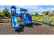 Community playground featuring slides and a bench for neighborhood residents at 5172 Copain Cove, Fuquay Varina, NC 27526