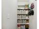 Convenient storage area with shelving and organized bins for optimal space utilization at 5172 Copain Cove, Fuquay Varina, NC 27526