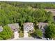 Aerial view of well-maintained homes in a suburban neighborhood with mature trees and landscaping at 5240 Holly Ridge Farm Rd, Raleigh, NC 27616