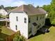 Aerial view of the rear of the house highlighting its architectural design, backyard, and more at 5240 Holly Ridge Farm Rd, Raleigh, NC 27616