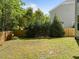 Fenced backyard featuring a grassy lawn with shade trees at 5240 Holly Ridge Farm Rd, Raleigh, NC 27616
