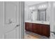 Bathroom featuring double sinks, sleek dark wood vanity, and lots of counter space at 5240 Holly Ridge Farm Rd, Raleigh, NC 27616