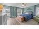Bright and airy bedroom features with large windows, wood floors, and a charming chest at 5240 Holly Ridge Farm Rd, Raleigh, NC 27616
