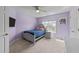 This charming bedroom features a comfy bed, natural light, and a soothing purple color scheme at 5240 Holly Ridge Farm Rd, Raleigh, NC 27616