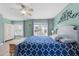 Spacious bedroom boasts with natural light, wood floors, and calming, green walls at 5240 Holly Ridge Farm Rd, Raleigh, NC 27616