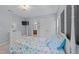 This bedroom features a whimsical 4-poster bed, large windows, and neutral paint at 5240 Holly Ridge Farm Rd, Raleigh, NC 27616