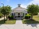 Charming community clubhouse with a metal roof, a welcoming entrance, and manicured landscaping at 5240 Holly Ridge Farm Rd, Raleigh, NC 27616
