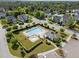 Aerial view of community pool featuring ample seating and a nearby covered lounge area at 5240 Holly Ridge Farm Rd, Raleigh, NC 27616