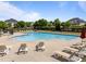 Resort-style pool with lounge chairs for residents at 5240 Holly Ridge Farm Rd, Raleigh, NC 27616
