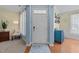 Inviting entryway with hardwood floors and stylish decor, showcasing the home's welcoming ambiance at 5240 Holly Ridge Farm Rd, Raleigh, NC 27616