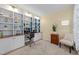 Well-lit home office with custom built-in shelving and a comfortable workspace at 5240 Holly Ridge Farm Rd, Raleigh, NC 27616