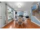Open-concept living space featuring dining area, living room, and staircase at 5240 Holly Ridge Farm Rd, Raleigh, NC 27616