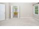 Bedroom with access to the en-suite bathroom, carpet, and large window at 5610 Picnic Rock Ln, Raleigh, NC 27613