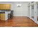 Bright dining area features hardwood floors, wainscoting, and access to the kitchen and outdoor living space at 5610 Picnic Rock Ln, Raleigh, NC 27613