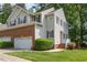 Exterior view of home featuring neutral siding, black shutters, and brick accents at 5610 Picnic Rock Ln, Raleigh, NC 27613