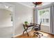Home office featuring hardwood floors, a window view, and a modern desk setup at 5610 Picnic Rock Ln, Raleigh, NC 27613