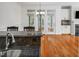 Updated kitchen includes granite counters, breakfast bar, and stainless steel sink at 5610 Picnic Rock Ln, Raleigh, NC 27613