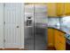 Spacious stainless steel refrigerator complementing the stylish kitchen at 5610 Picnic Rock Ln, Raleigh, NC 27613