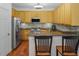 Well-appointed kitchen with stainless steel appliances, granite countertops, and wood cabinetry at 5610 Picnic Rock Ln, Raleigh, NC 27613