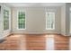 Bright living room offers large windows and hardwood floors at 5610 Picnic Rock Ln, Raleigh, NC 27613