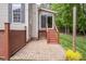 Cozy outdoor patio with brick flooring and string lights, ideal for entertaining at 5610 Picnic Rock Ln, Raleigh, NC 27613