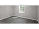 Simple bedroom featuring carpet floors, neutral paint, and a window at 567 Howard Tant Rd, Zebulon, NC 27597