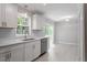 Modern kitchen featuring stainless steel appliances and gray subway tile backsplash at 567 Howard Tant Rd, Zebulon, NC 27597