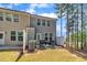 Spacious backyard with patio, grill, fenced area, and views of mature trees at 5701 Princess Curry Way, Raleigh, NC 27610