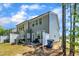 Backyard with a patio, grill, trash can, and partial fencing, offering a nice outdoor space at 5701 Princess Curry Way, Raleigh, NC 27610