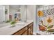 Bright bathroom featuring modern vanity, decorative floral shower curtain, and stylish decor at 5701 Princess Curry Way, Raleigh, NC 27610
