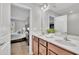 Bathroom with double vanity and view into the bedroom at 5701 Princess Curry Way, Raleigh, NC 27610