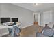 Neutral bedroom featuring a desk with two monitors, gray walls, and comfortable seating at 5701 Princess Curry Way, Raleigh, NC 27610