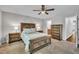 Bedroom with wooden furniture set, and a view into the bathroom at 5701 Princess Curry Way, Raleigh, NC 27610