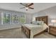 Bedroom with a wooden bed frame and ceiling fan at 5701 Princess Curry Way, Raleigh, NC 27610