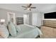Spacious bedroom with large television and multiple closets at 5701 Princess Curry Way, Raleigh, NC 27610