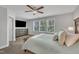 Bright bedroom featuring large windows and modern furnishings at 5701 Princess Curry Way, Raleigh, NC 27610