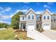 Inviting two-story home with well-kept lawn, landscaping, and a welcoming entrance at 5701 Princess Curry Way, Raleigh, NC 27610