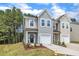 Charming two-story home with well-maintained lawn, landscaping, and inviting curb appeal at 5701 Princess Curry Way, Raleigh, NC 27610