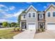 Attractive two-story home featuring neat landscaping, a driveway, and attached garage at 5701 Princess Curry Way, Raleigh, NC 27610