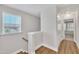 Hallway with natural light from the window near the stairs and a view of a bedroom at 5701 Princess Curry Way, Raleigh, NC 27610