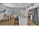 Open concept kitchen with stainless steel appliances, granite countertops, and dining area at 5701 Princess Curry Way, Raleigh, NC 27610