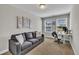 Living room with sofa and desk setup, perfect for home office at 5701 Princess Curry Way, Raleigh, NC 27610