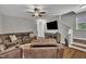 Relaxing living room with contemporary furnishings and a neutral color scheme at 5701 Princess Curry Way, Raleigh, NC 27610