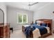 A classic bedroom featuring a wood bed frame, a ceiling fan, and traditional dressers at 5803 Vintage Oak Ln, Raleigh, NC 27613